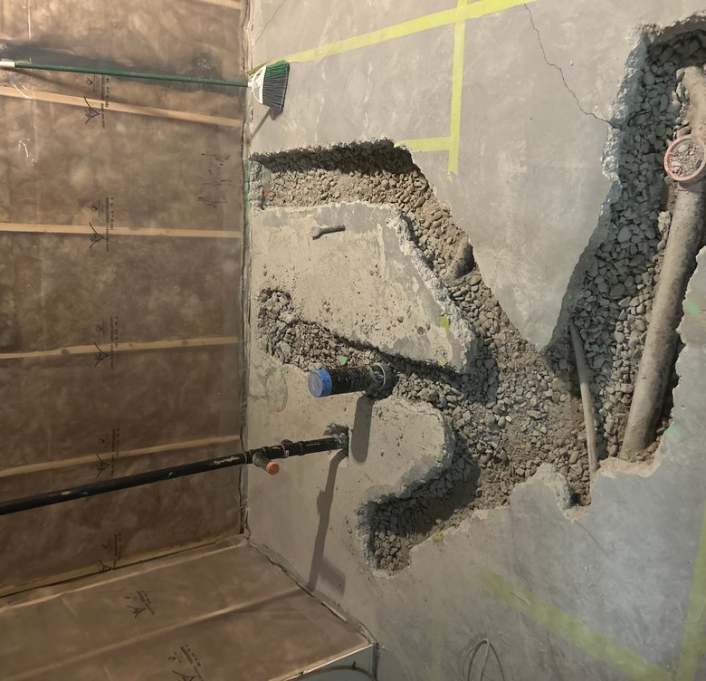 Open concept finished basement with seating area